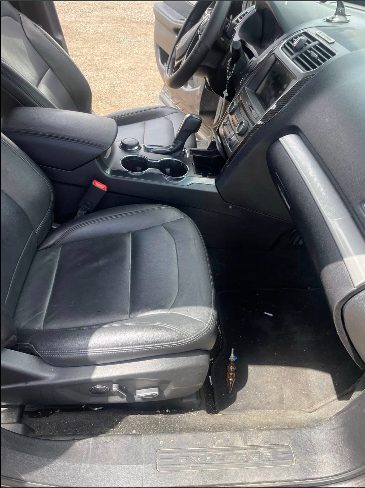 Cleaned front leather seats of a Ford Explorer after a ShineCraft mobile interior detail in Olathe, KS.